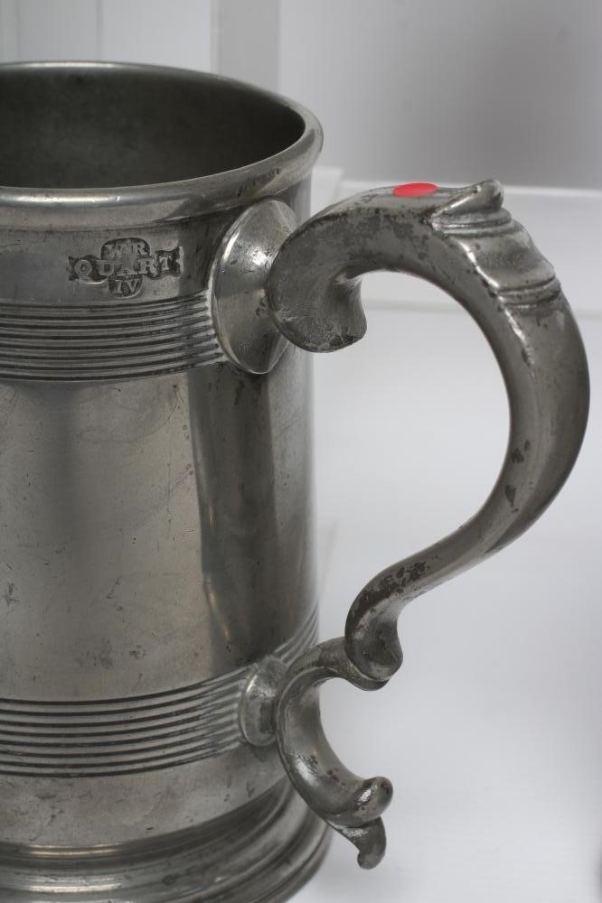 A GROUP OF FIVE PEWTER QUART REEDED MUGS, 19th century, one straight sided, the others of tulip form Image