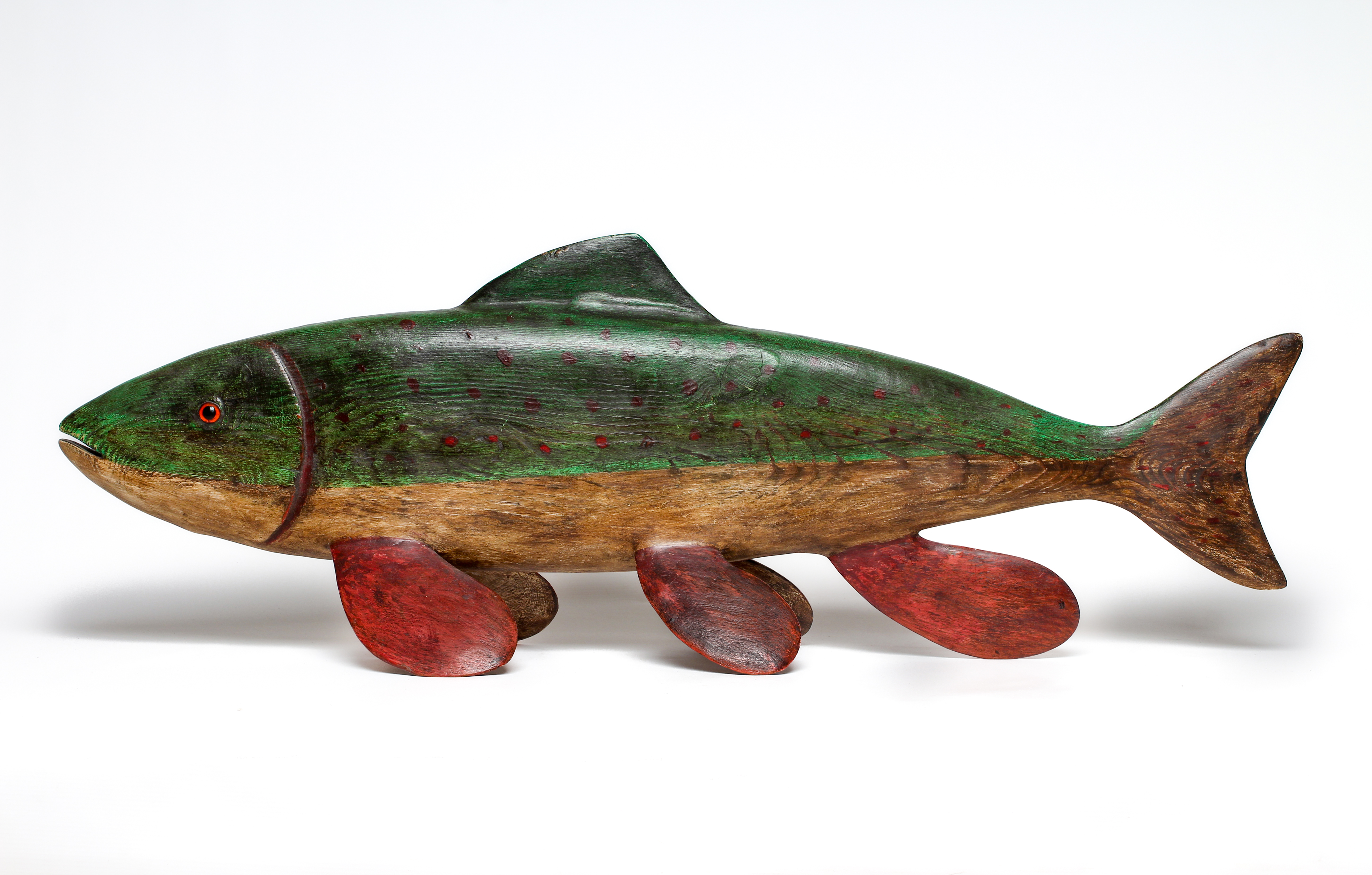 GUY TAPLIN (b.1939) a carved and painted model of a fish with inset amber eyes, signed, 40 x 14 Image