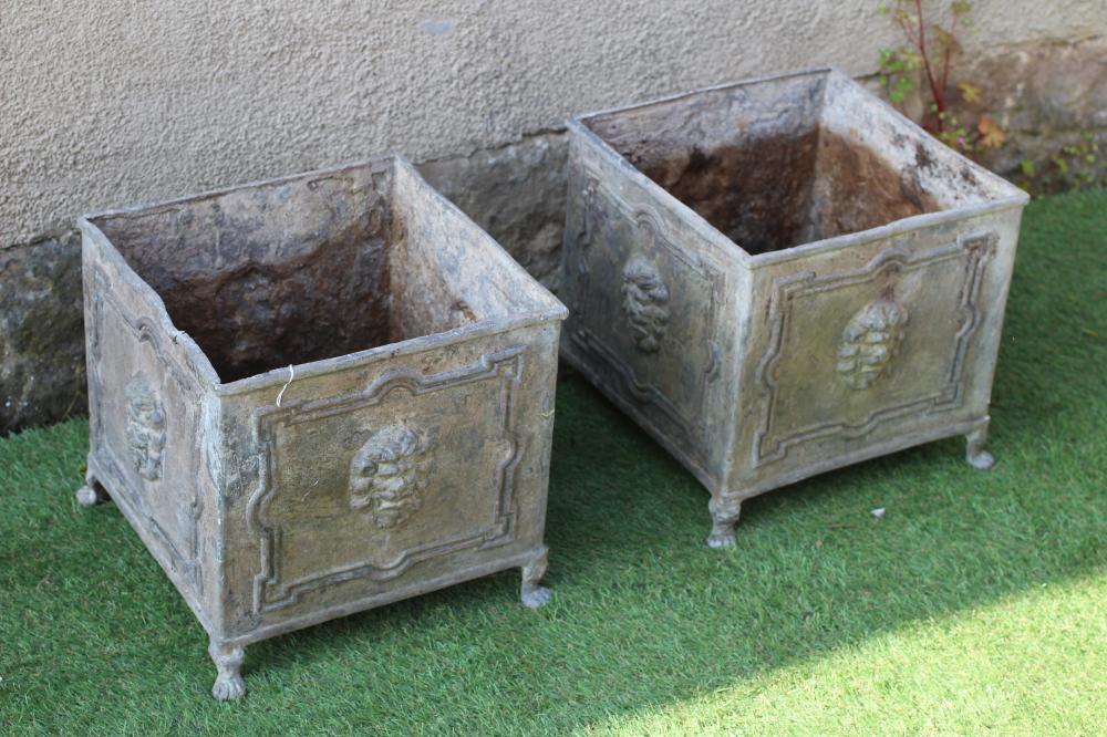 A PAIR OF LEAD PLANTERS, 20th century, of square form, the panelled sides with lion masks, raised on Image
