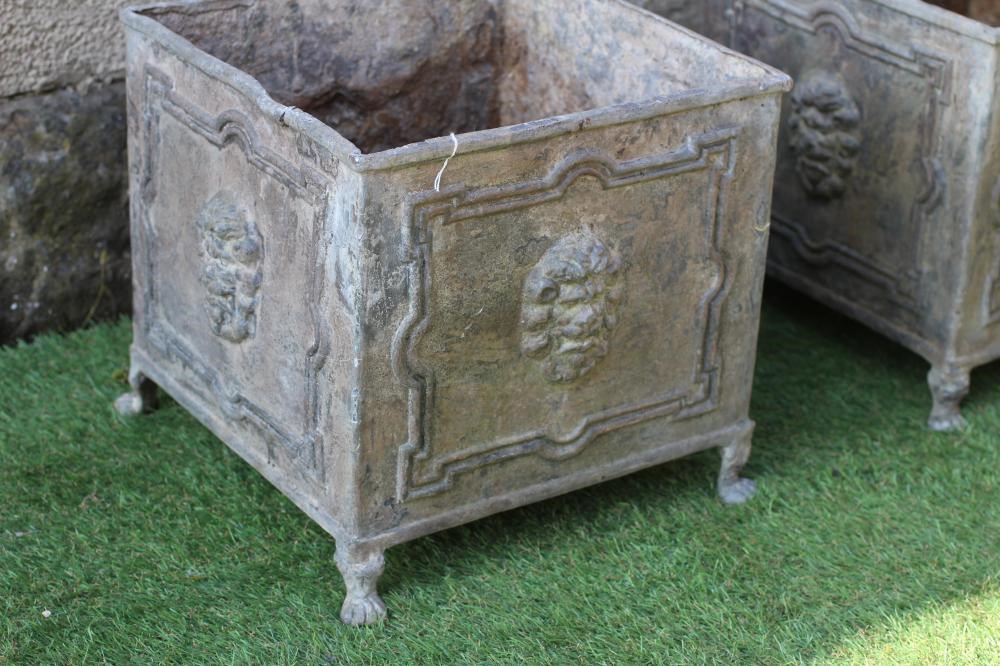A PAIR OF LEAD PLANTERS, 20th century, of square form, the panelled sides with lion masks, raised on Image