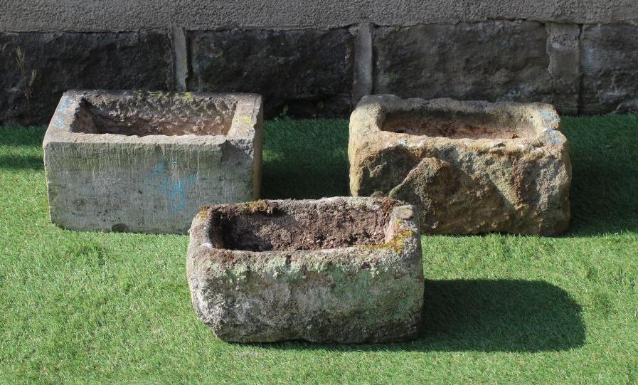 A SMALL SANDSTONE TROUGH, oblong, 15" x 10" x 7", together with two others, similar (3) (Est. plus Image