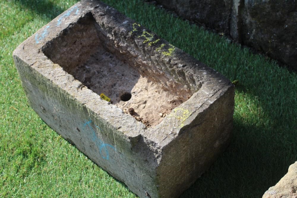 A SMALL SANDSTONE TROUGH, oblong, 15" x 10" x 7", together with two others, similar (3) (Est. plus Image