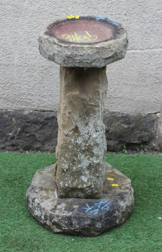 A SANDSTONE BIRD BATH, the rough hewn octagonal bowl raised on square tapering stem and octagonal Image
