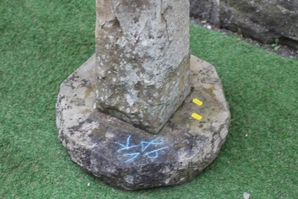 A SANDSTONE BIRD BATH, the rough hewn octagonal bowl raised on square tapering stem and octagonal Image