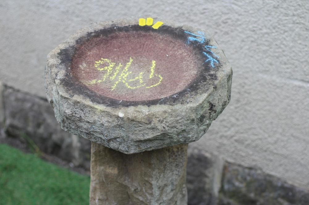 A SANDSTONE BIRD BATH, the rough hewn octagonal bowl raised on square tapering stem and octagonal Image