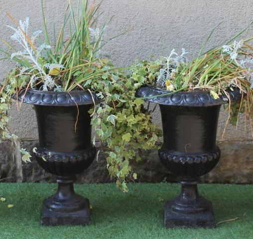 A PAIR OF CAST IRON URNS of half fluted campana form with ovolu rims, waisted socle and square base, Image