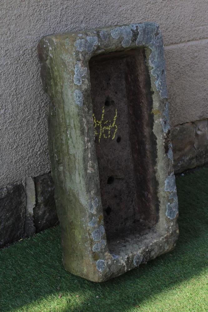 A SANDSTONE TROUGH of rough hewn oblong form, 27 1/2" x 13 1/2" x 72" (Est. plus 24% premium inc. Image
