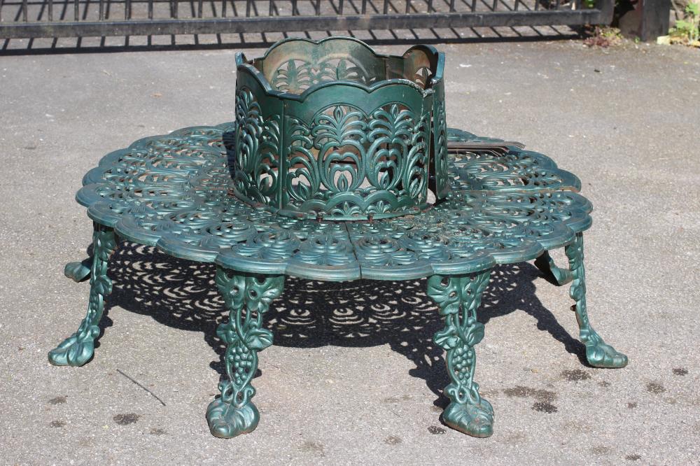 A CAST IRON TREE SEAT Image