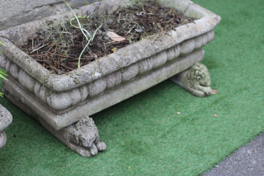 A PAIR OF COMPOSITION STONE JARDINIERES of oblong form with everted rims and cushion moulded sides Image