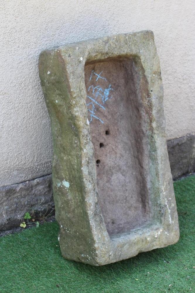 A SANDSTONE TROUGH of rough hewn oblong form, 31 1/2" x 16 1/2" x 9" (Est. plus 24% premium inc. Image
