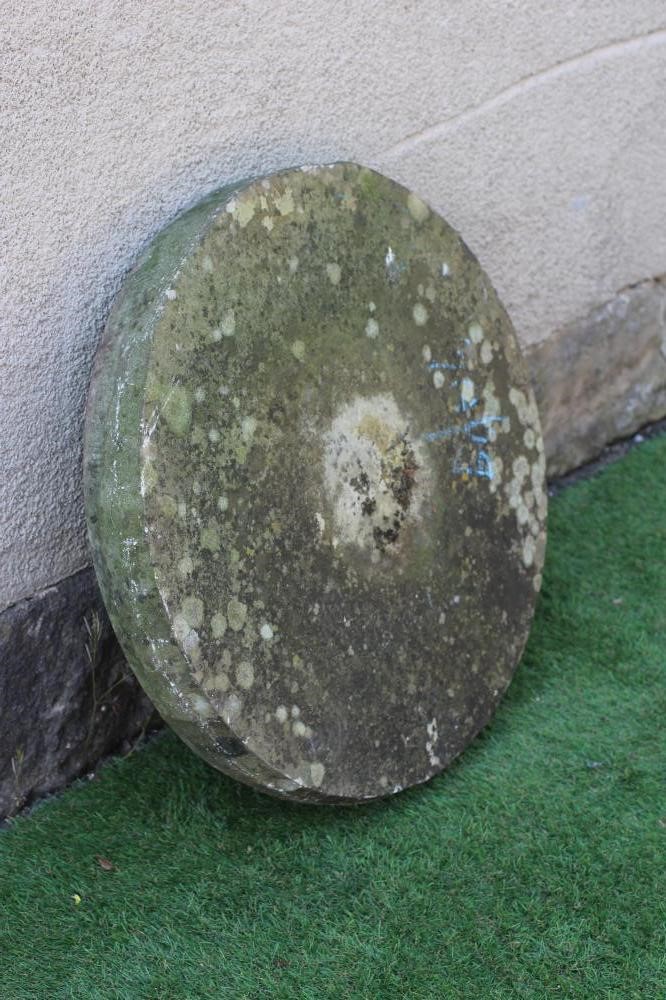 A SANDSTONE MILL WHEEL, 23 1/2" high, together with a square sandstone trough, 18" x 18" x 9" (2) Image