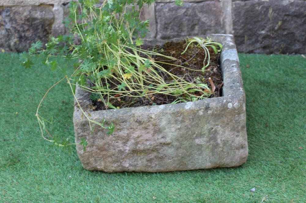 A SMALL SANDSTONE TROUGH of mildly irregular oblong form, 19/ 2" x 18 1/2" x 10", together with Image