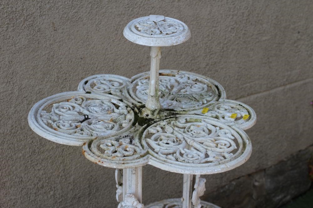 A VICTORIAN CAST IRON CONSERVATORY PLANT STAND of lobed two tier form pierced and moulded with Image