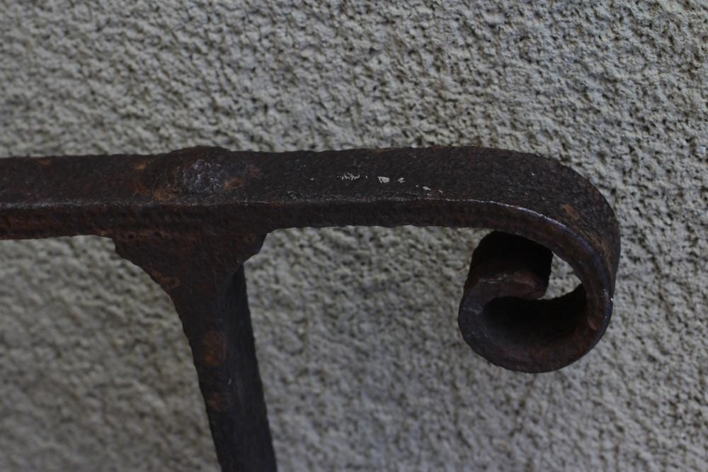 A VICTORIAN CAST IRON GARDEN GATE of two tier barred form with fleur de lys finials and scroll Image