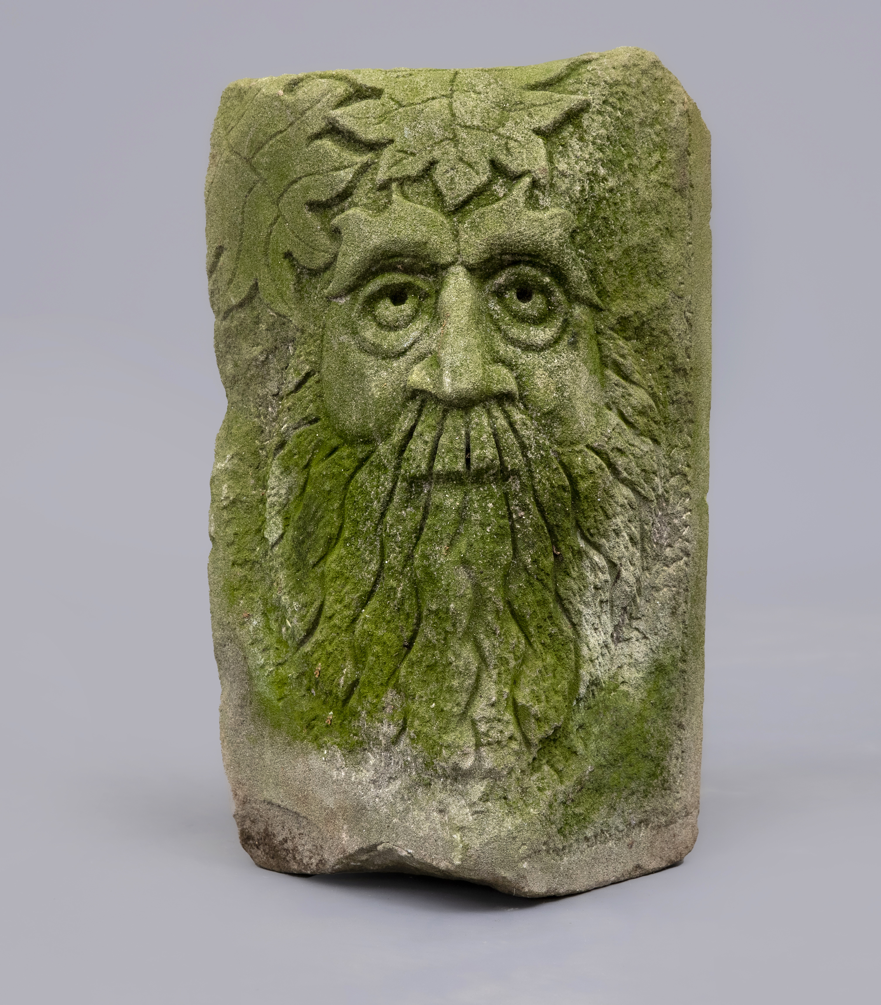 A CARVED SANDSTONE GREEN MAN MASK CORNER STONE, 10 1/4" X 17" (Illustrated) (Est. plus 24% premium Image