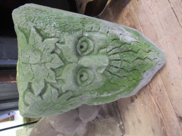 A CARVED SANDSTONE GREEN MAN MASK CORNER STONE, 10 1/4" X 17" (Illustrated) (Est. plus 24% premium Image