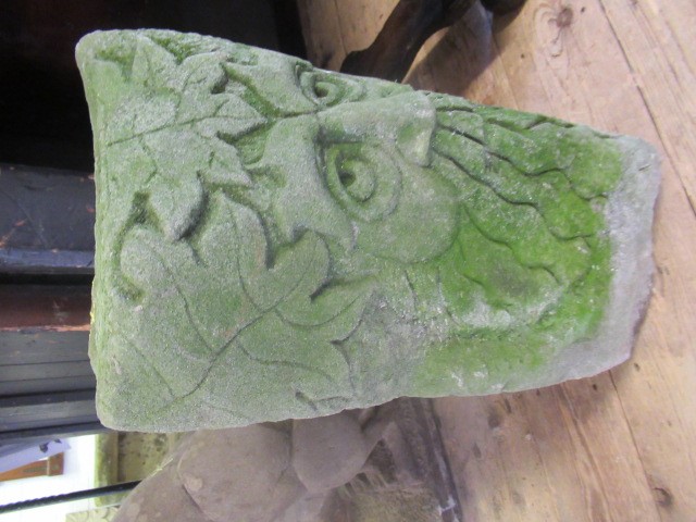 A CARVED SANDSTONE GREEN MAN MASK CORNER STONE, 10 1/4" X 17" (Illustrated) (Est. plus 24% premium Image