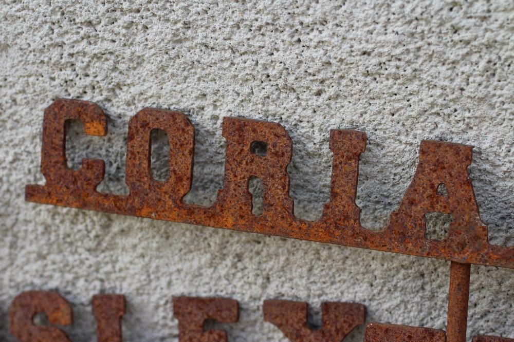 A SET OF TEN RECLAIMED METAL HERB LABELS, each on a turned post with rust patination, 6" - 13" x 37 Image