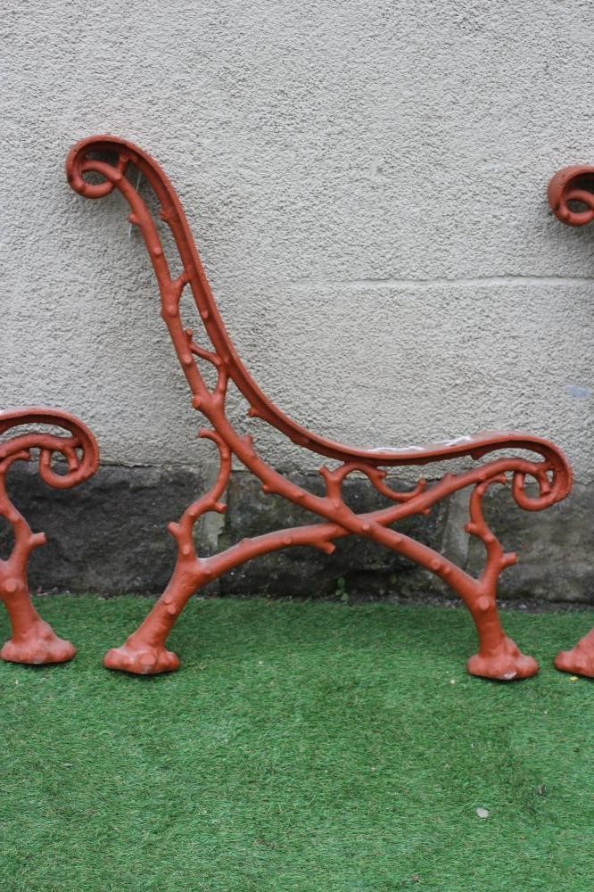 A SET OF THREE VICTORIAN CAST IRON PARK BENCH SUPPORTS in truncated branch pattern, 26 1/2" x 29" Image