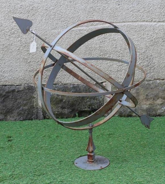 A WROUGHT IRON ARMILLARY SPHERE with spear head finial, on triangular stem and circular base, 28 Image