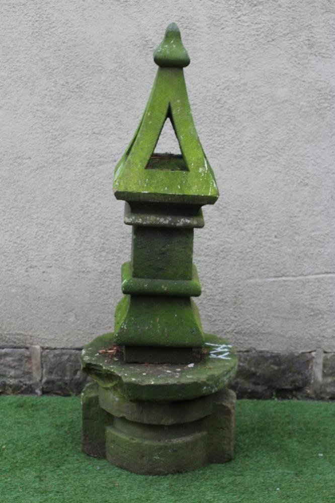 A SANDSTONE FINIAL of square form, the pierced tapering surmount with ogee finial, on ogee moulded Image
