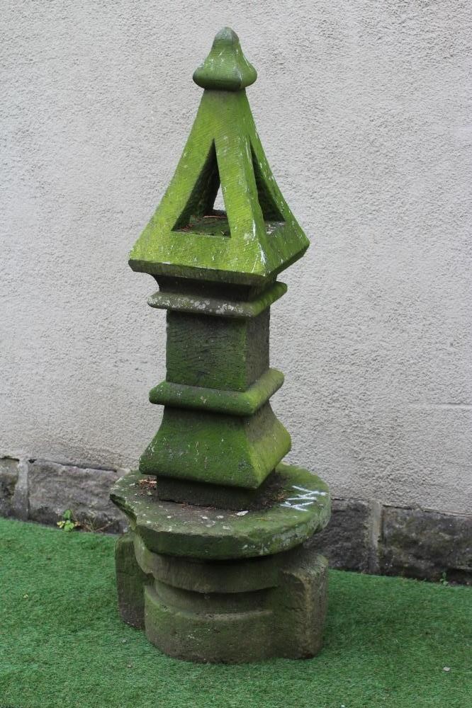 A SANDSTONE FINIAL of square form, the pierced tapering surmount with ogee finial, on ogee moulded Image