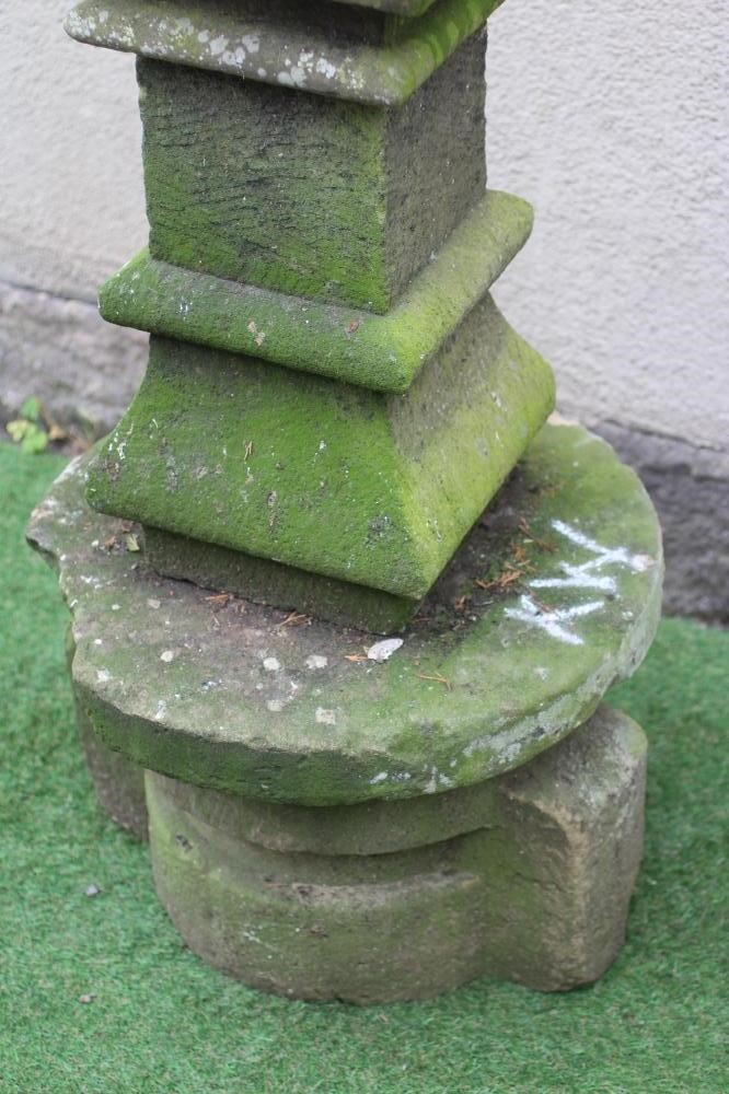 A SANDSTONE FINIAL of square form, the pierced tapering surmount with ogee finial, on ogee moulded Image
