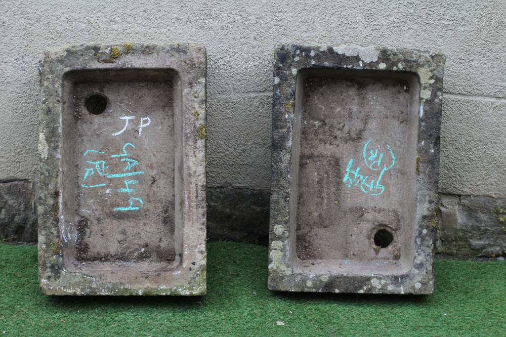 A MATCHED PAIR OF SANDSTONE TROUGHS of shallow, well cut oblong form, 27 1/2" x 18 1/2" x 6 1/2" Image