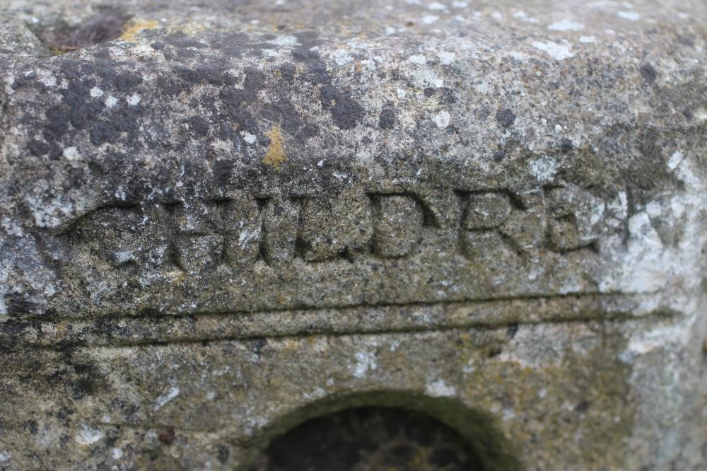 A SUBSTANTIAL SANDSTONE PLANTER, 19th century, of deep circular form carved with a band of Image