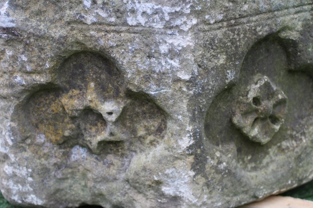 A SUBSTANTIAL SANDSTONE PLANTER, 19th century, of deep circular form carved with a band of Image