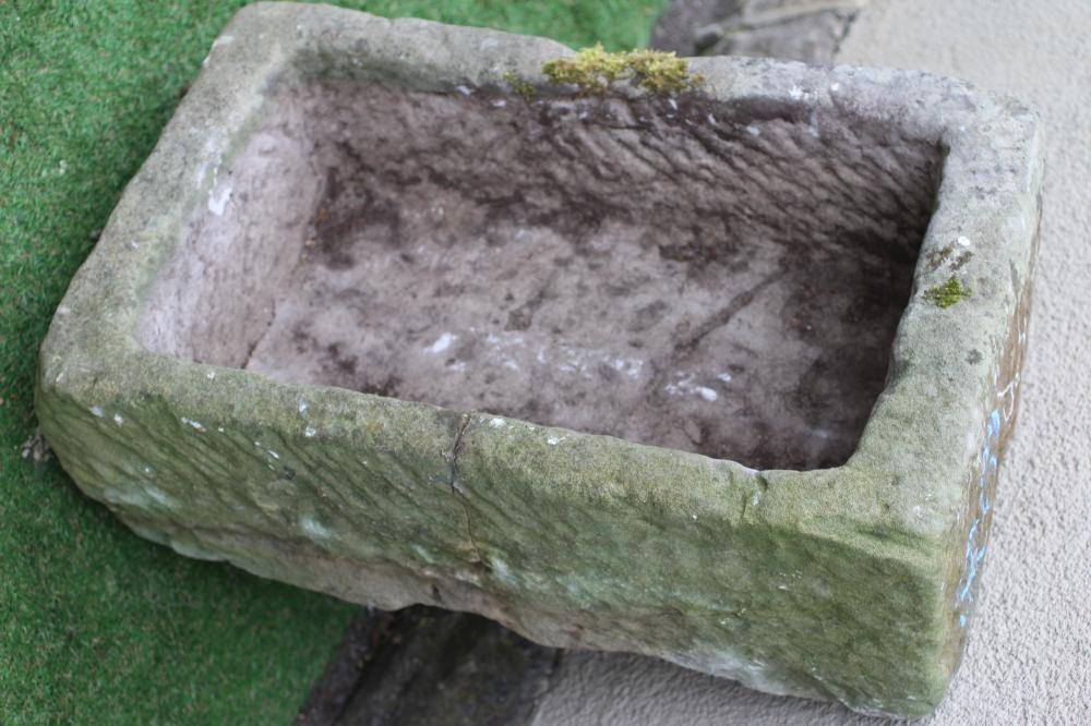 A SANDSTONE TROUGH of rough hewn oblong form, 27 1/2" x 17" x 10" (Est. plus 24% premium inc. VAT) Image