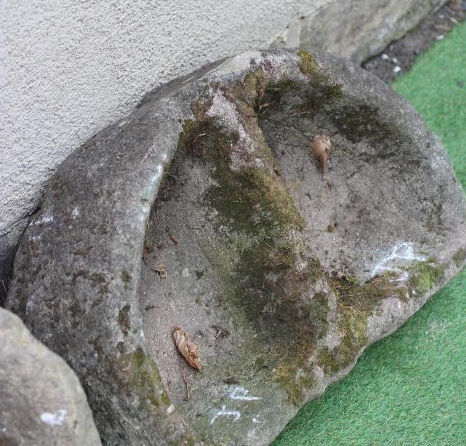A SANDSTONE TROUGH of rough hewn circular form Image