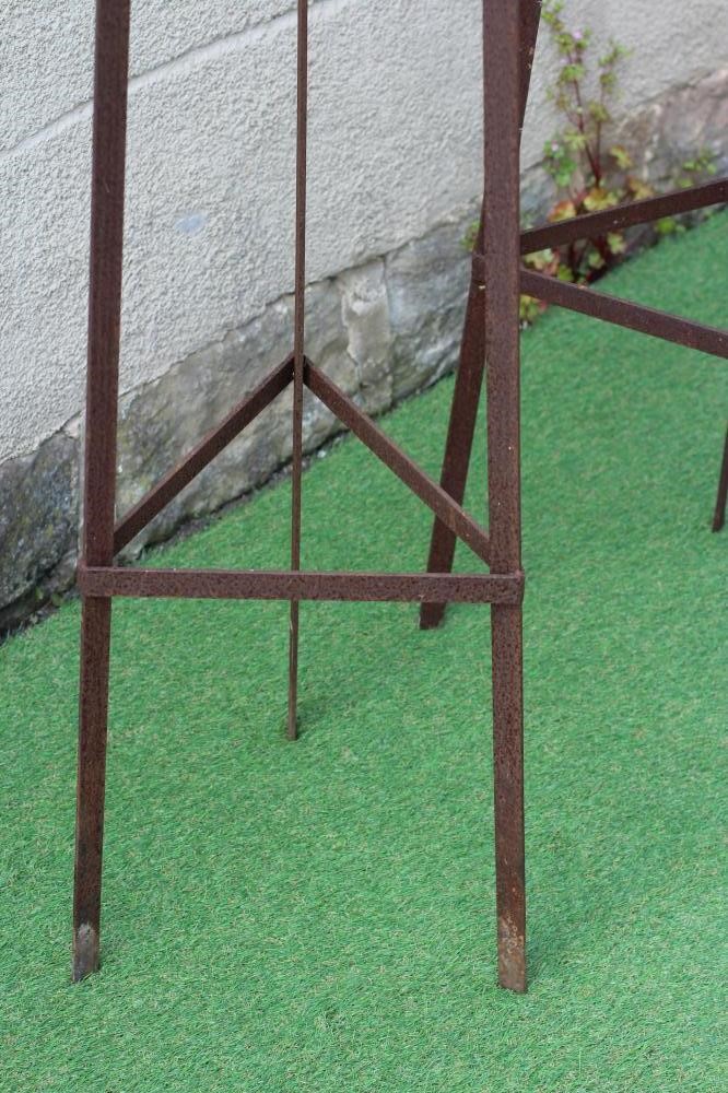 A PAIR OF WROUGHT IRON PLANT OBELISKS of tapering triangular form with scroll finials, rust Image