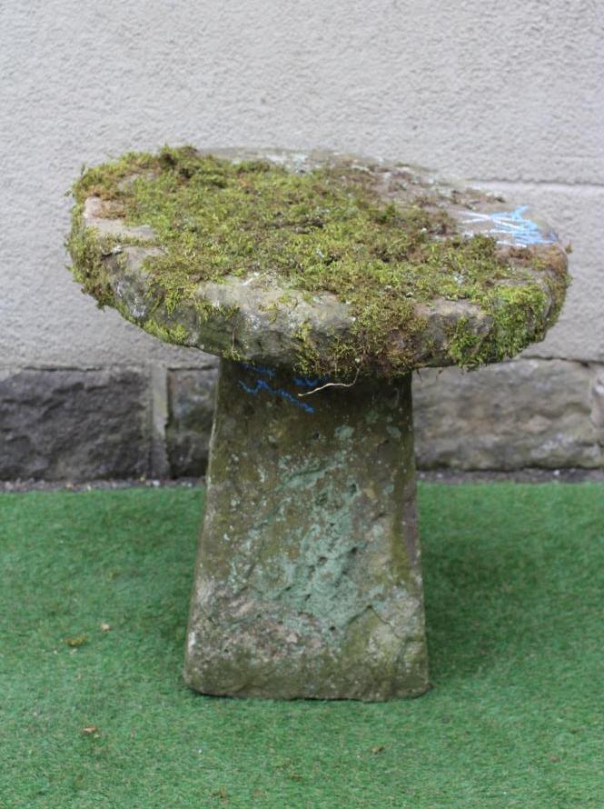 A SANDSTONE BIRD FEEDER, the circular top raised on square tapering stem, 27 1/2" x 27" (Est. plus Image