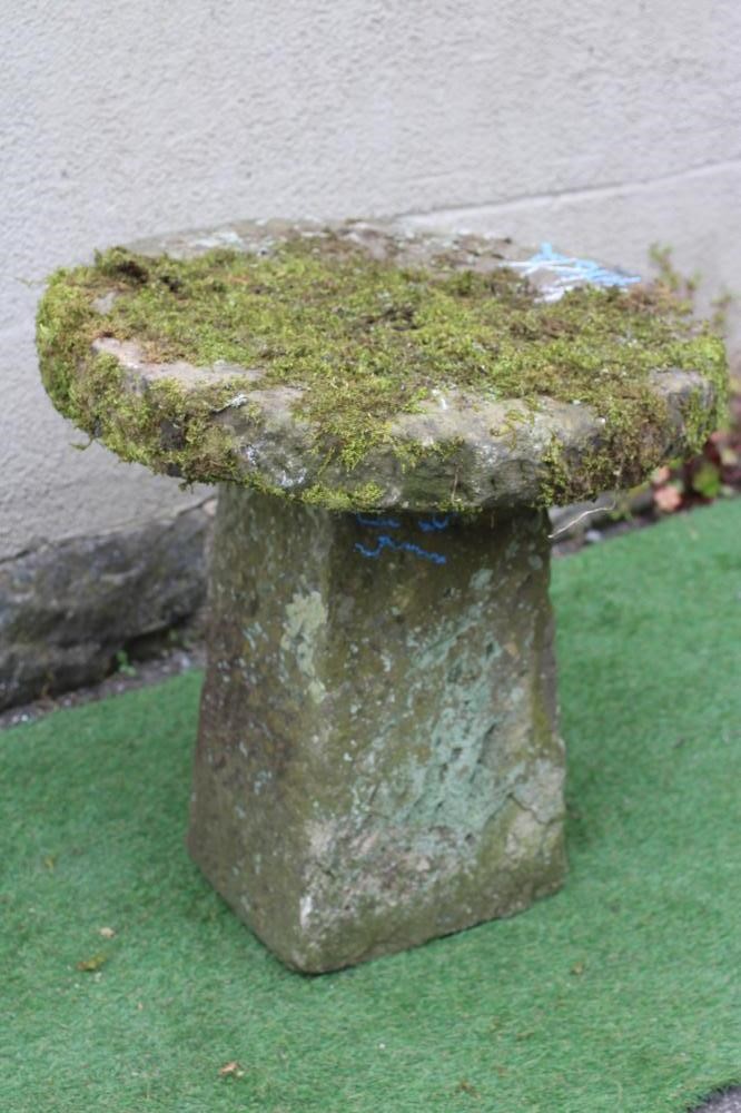 A SANDSTONE BIRD FEEDER, the circular top raised on square tapering stem, 27 1/2" x 27" (Est. plus Image