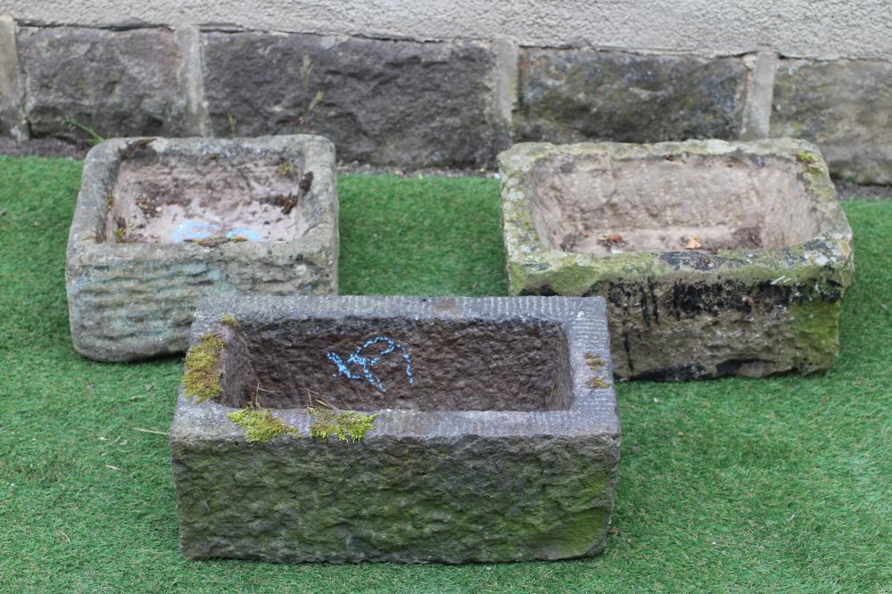 A SMALL SANDSTONE TROUGH of rough hewn oblong form, 18" x 12"x 8", another, 20" x 11"x 7 3/4", and a Image
