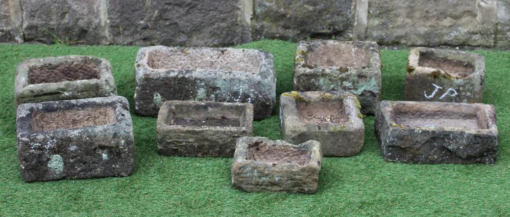 NINE VARIOUS SMALL SANDSTONE TROUGHS of oblong form, 9" - 16" wide (Est. plus 24% premium inc. VAT) Image