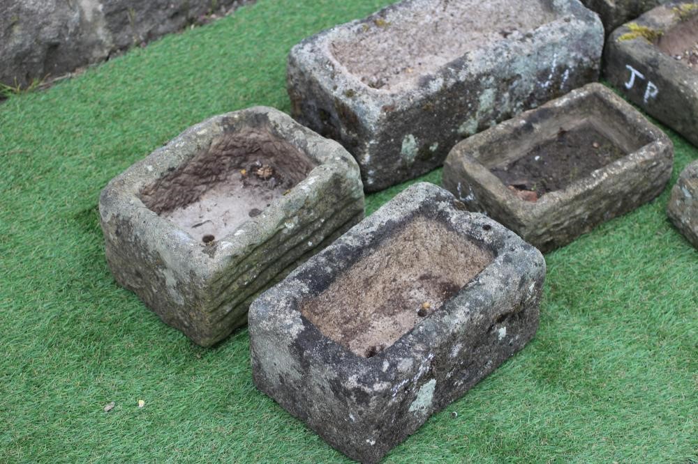 NINE VARIOUS SMALL SANDSTONE TROUGHS of oblong form, 9" - 16" wide (Est. plus 24% premium inc. VAT) Image