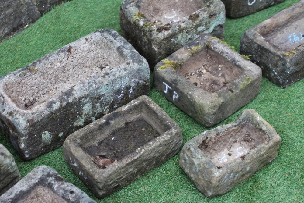 NINE VARIOUS SMALL SANDSTONE TROUGHS of oblong form, 9" - 16" wide (Est. plus 24% premium inc. VAT) Image