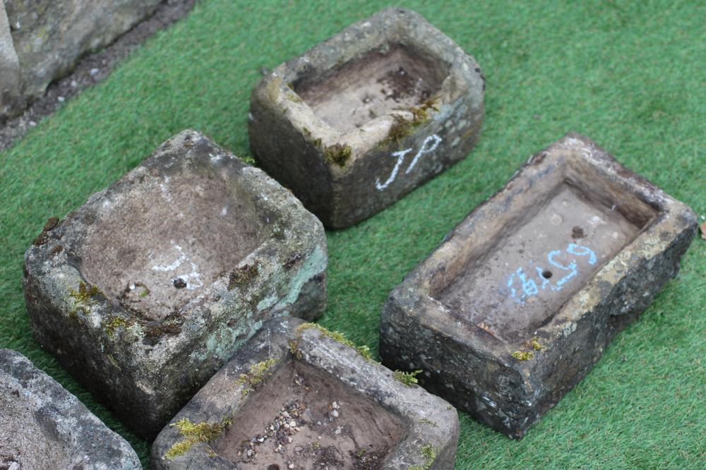 NINE VARIOUS SMALL SANDSTONE TROUGHS of oblong form, 9" - 16" wide (Est. plus 24% premium inc. VAT) Image