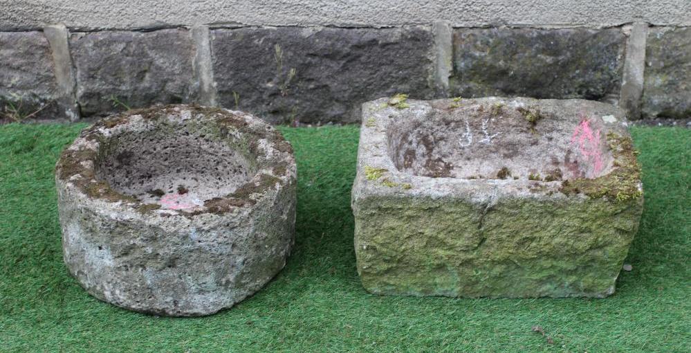 A SANDSTONE TROUGH of rough hewn circular form, 15 1/2" x 8", together with another of oblong form, Image