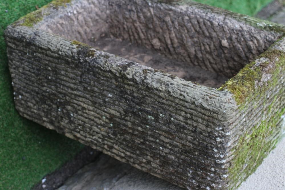 A SANDSTONE TROUGH of well cut oblong form with line banding, 27 1/2" x 17" x 11" (Est. plus 24% Image