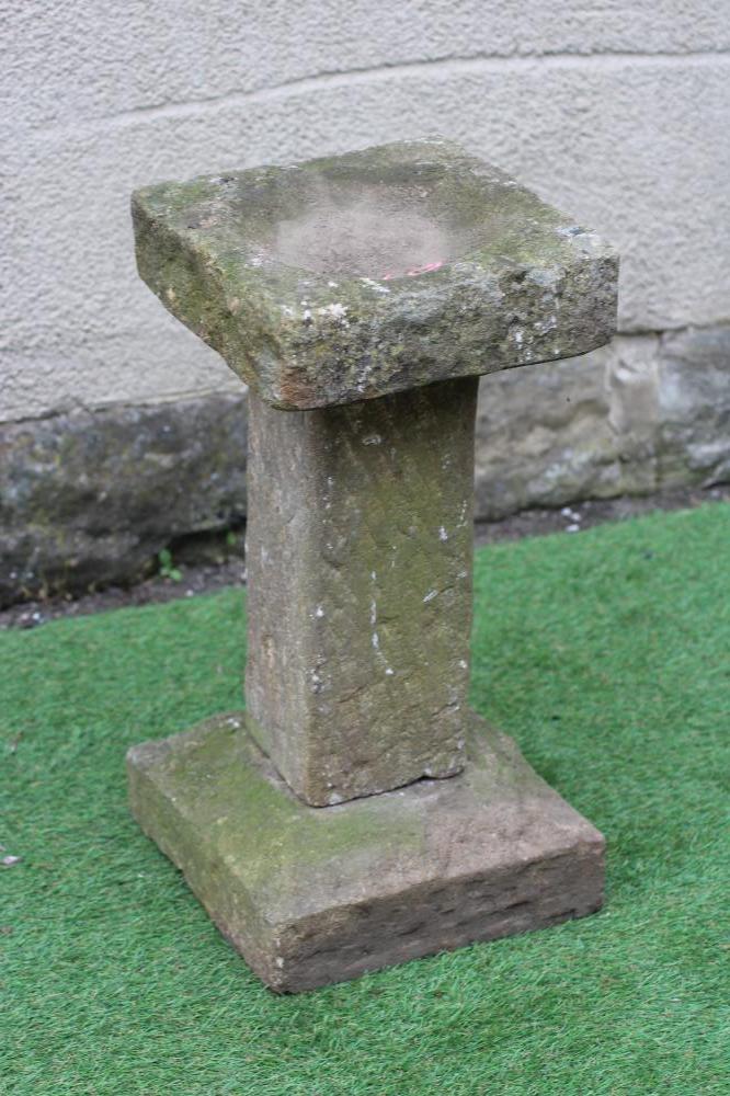 A SANDSTONE BIRD BATH of rough hewn square form, 12" x 24" (Est. plus 24% premium inc. VAT) Image