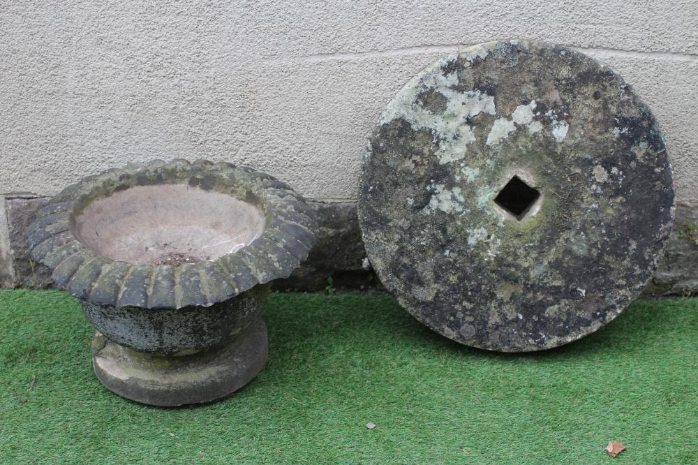 A SMALL SANDSTONE FOUNTAIN, the bowl with everted ovolu moulded rim, on moulded circular base, 21" x Image