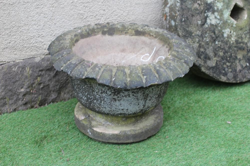 A SMALL SANDSTONE FOUNTAIN, the bowl with everted ovolu moulded rim, on moulded circular base, 21" x Image