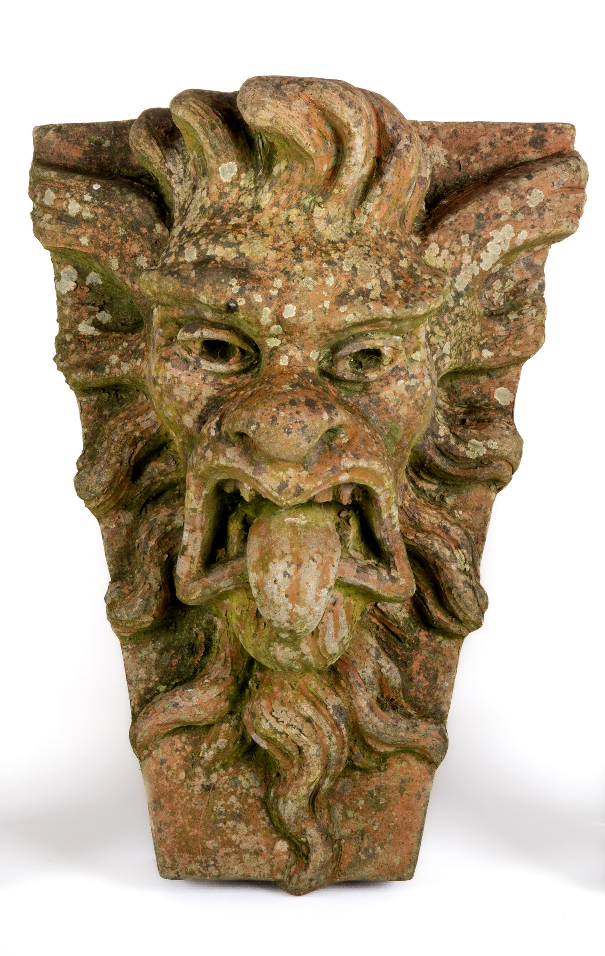 A TERRACOTTA GARGOYLE KEY STONE, by Alan Frost, boldly modelled in high relief, signed and dated Image