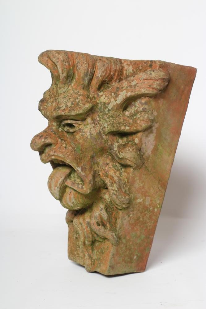 A TERRACOTTA GARGOYLE KEY STONE, by Alan Frost, boldly modelled in high relief, signed and dated Image