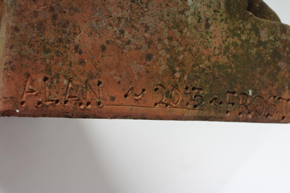 A TERRACOTTA GARGOYLE KEY STONE, by Alan Frost, boldly modelled in high relief, signed and dated Image