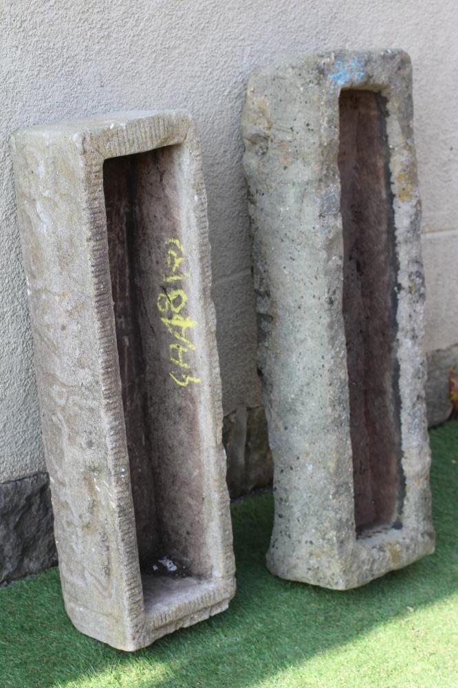 A SANDSTONE TROUGH of rough hewn narrow oblong form, 39 1/2" x 12"x 9", together with a similar Image