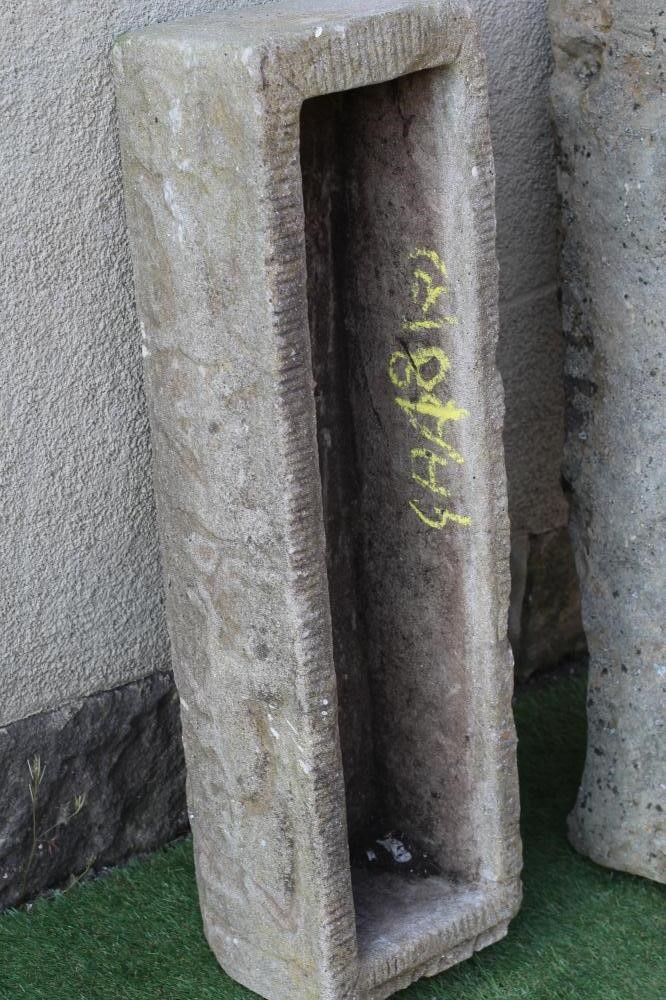 A SANDSTONE TROUGH of rough hewn narrow oblong form, 39 1/2" x 12"x 9", together with a similar Image